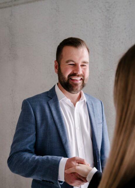 Photo of Lifestyle Finance Group Team Nick standing with client shaking hands